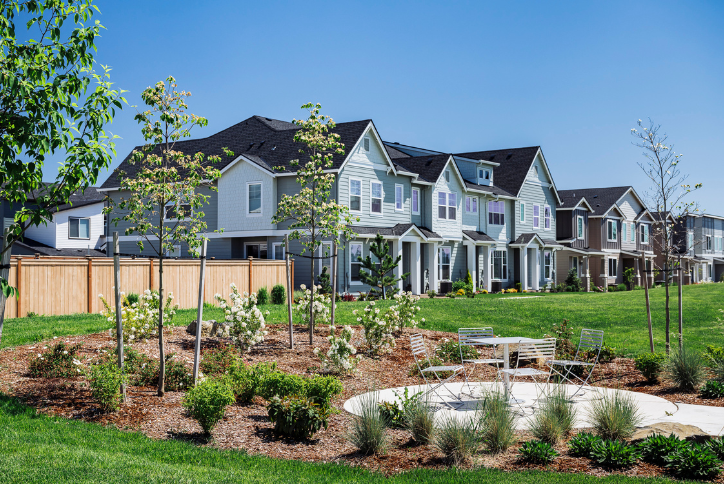 A row of homes sits next to a park on a sunny day at Reed’s Crossing in South Hillsboro.