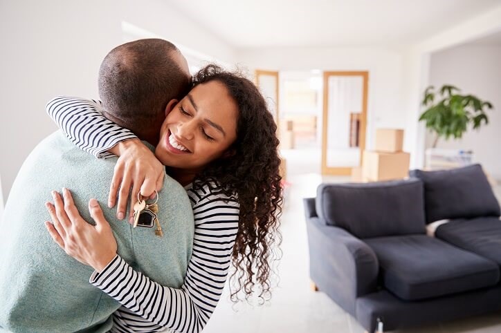 Couple Hugging in New Home