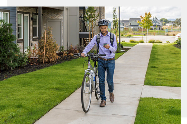 man-walking-bike-reeds-crossing-hillsboro-or.jpg
