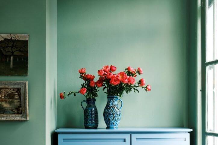 Farrow & Ball’s 2022 color of the year, Breakfast Room Green, used as a bold wall color.