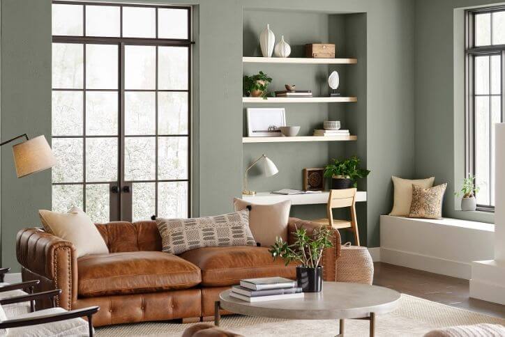 Sherwin-Williams’ 2022 color of the year, Evergreen Fog, is a muted olive green.