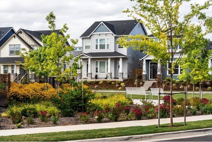 A green space with well-maintained landscaping on a street in Reed’s Crossing.