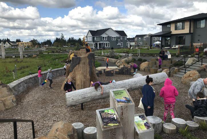Children play and learn in the Nature Education Area at Reed’s Crossing.