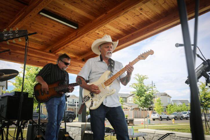 A band plays at an event in Tamarack Park at Reed’s Crossing.