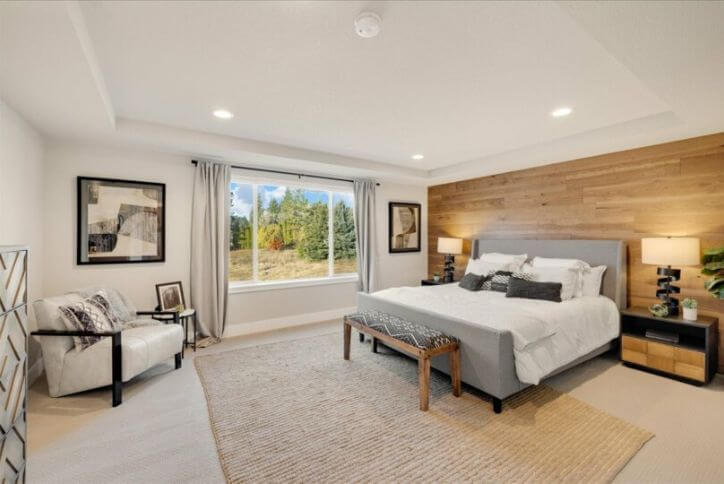 A large primary bedroom suite from Pacific Northwest builder Holt Homes.