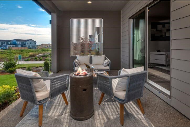 A fire pit and comfortable seating help create an outdoor living room.