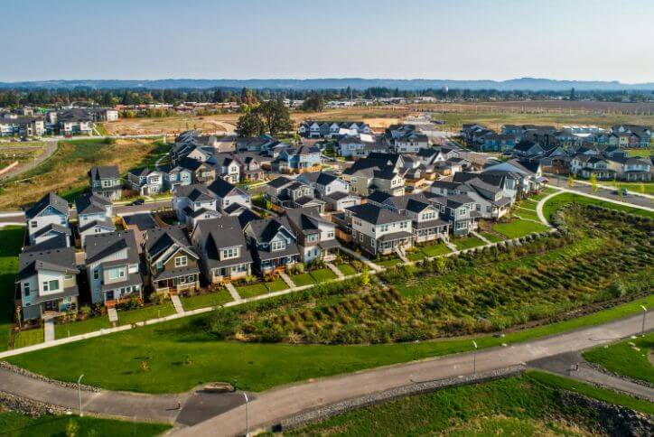 Alt text: Aerial shot of new homes lining the Reed’s Crossing Greenway in South Hillsboro.