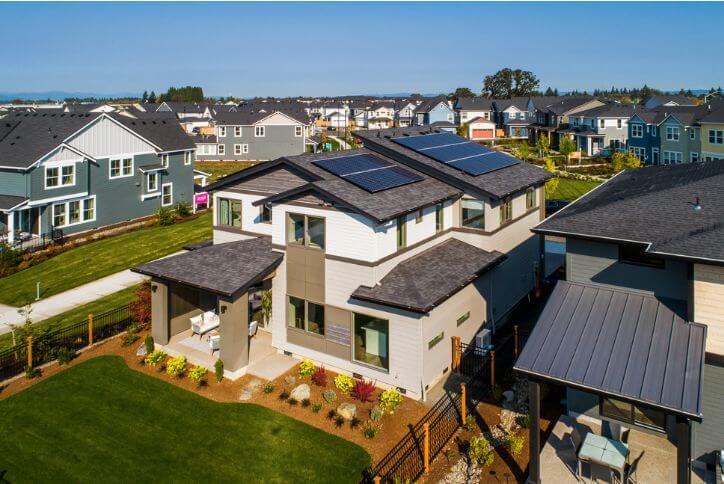 Drone photo of a sustainable home at Reed’s Crossing with solar panels on the roof.