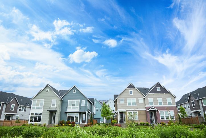 Modern townhomes for sale in Hillsboro, Oregon line the plant-filled Reed’s Crossing Greenway.