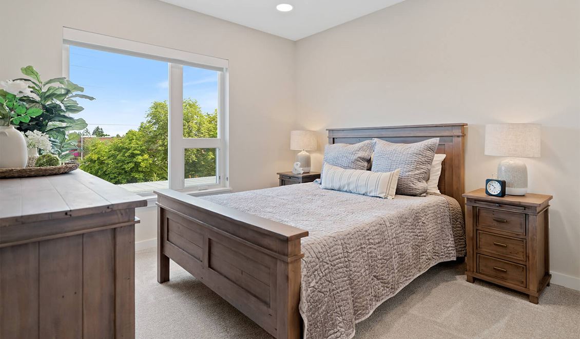 The Ackerly interior model home bedroom at Reed's Crossing in Hillsboro, Oregon