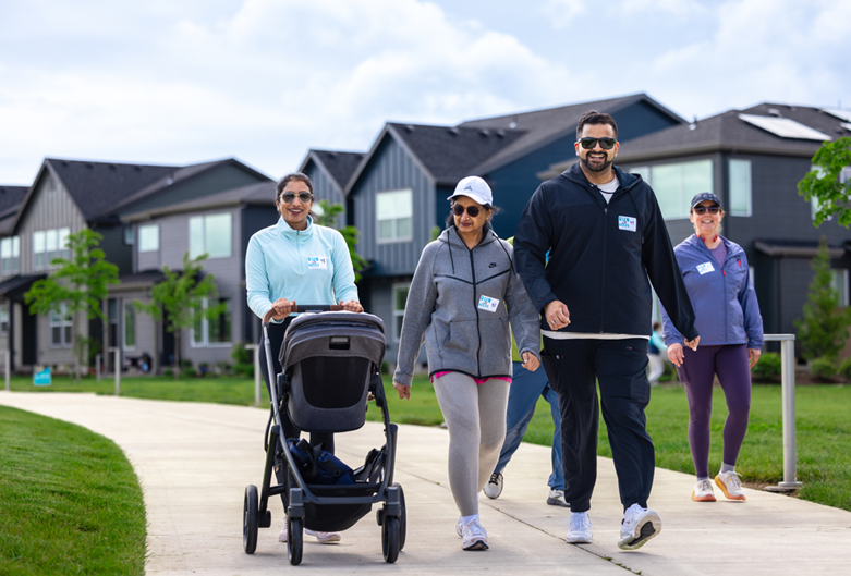 Group of walkers on path in new community