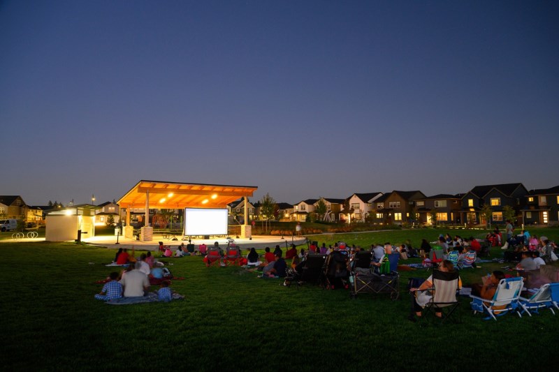 Residents of South Hillsboro gather in Reed’s Crossing Park for a movie at dusk.