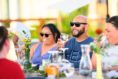 Neighbors enjoy an al fresco meal together in the Reed’s Crossing community.