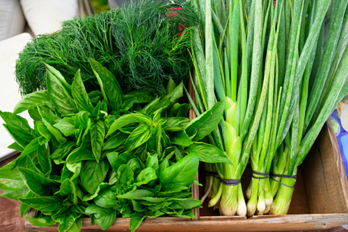 Leafy green herbs and vegetables on display at the Hillsboro Farmers’ Market in Reeds’ Crossing.