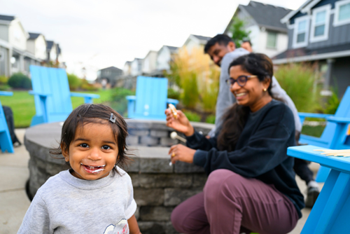 Residents of Reed’s Crossing in Hillsboro, Oregon enjoy s’mores at community firepit night.