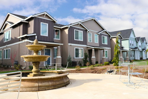 A fountain surrounded by tables & chairs inspires neighbors to gather in Reed’s Crossing.