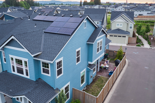 Aerial shot of a new construction home in Hillsboro, Oregon with solar panels on the roof.