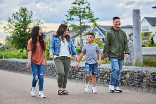 A family walks along the Greenway in Hillsboro’s Reed’s Crossing neighborhood.