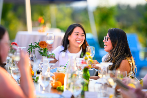 Friends and neighbors enjoy dinner in the Reed’s Crossing community garden.