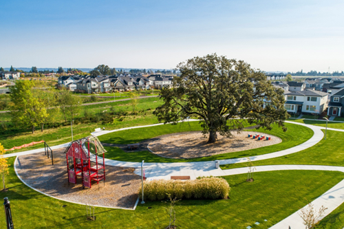 Aerial photo of Dobbin Park in Reed’s Crossing, with its eye-catching red barn play structure.